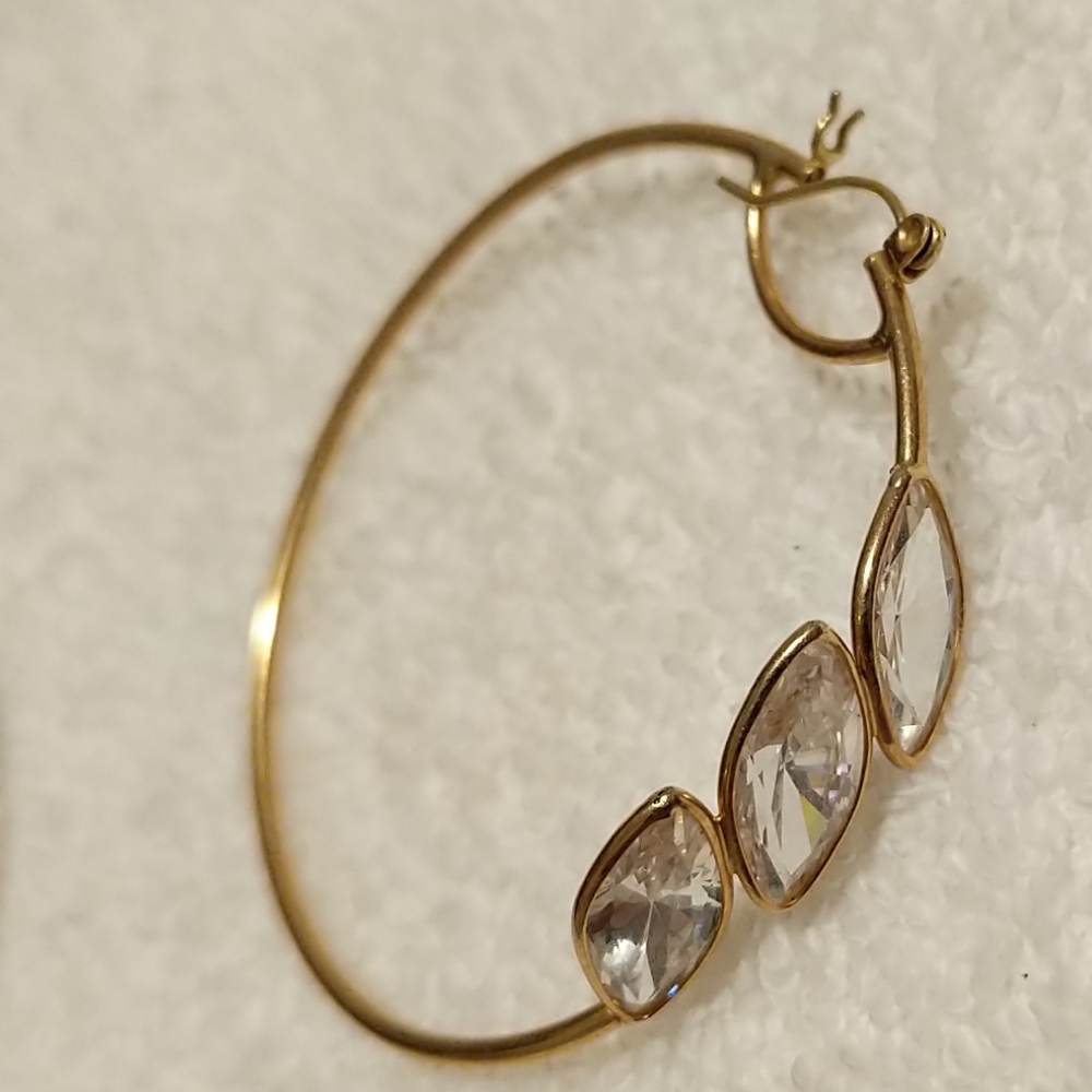 Gold hoop earrings with diamond shaped crystals